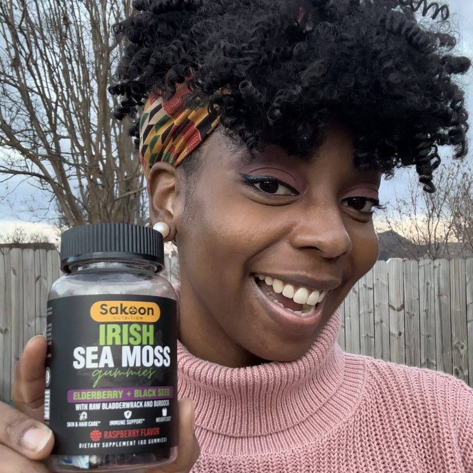 Woman holding Sakoon sea moss gummies