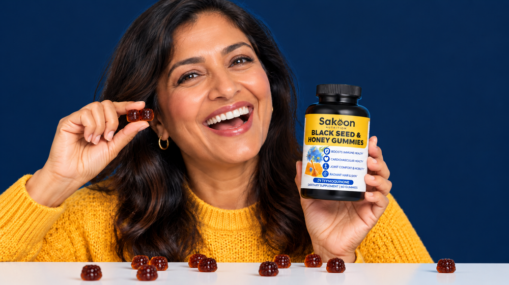 Woman laughing holding a Sakoon gummy and bottle